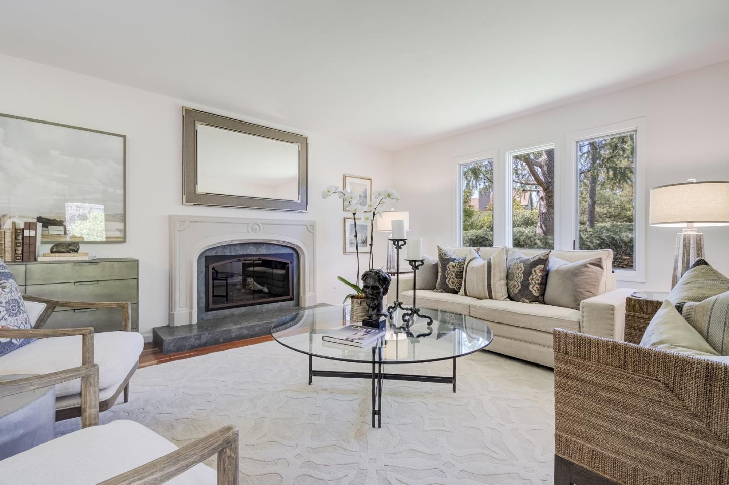 370 Quinnhill Road Los Altos, CA 94024 - Photo 7 of 58 a living room with furniture a fireplace and a table