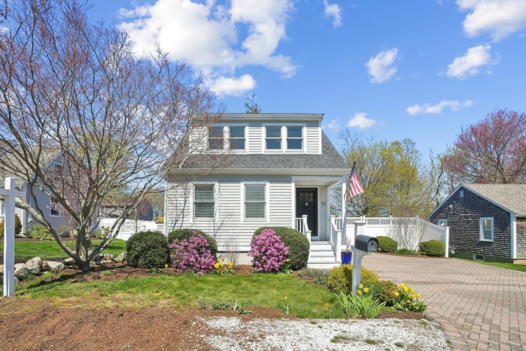 12 Hawley Road Scituate, MA 02066 - Photo 24 of 24 a front view of a house with a garden and trees