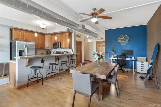 a kitchen with stainless steel appliances granite countertop a refrigerator a stove top oven a sink and dishwasher