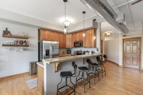 a kitchen with appliances cabinets and a sink
