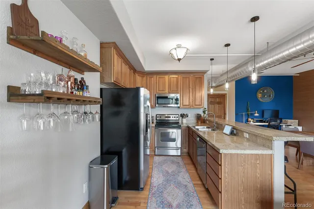 a kitchen with a sink and a large window