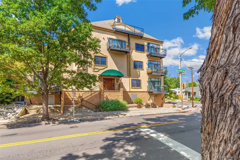 a view of a building with a street