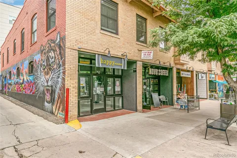 a view of a patio with table and chairs and potted plants