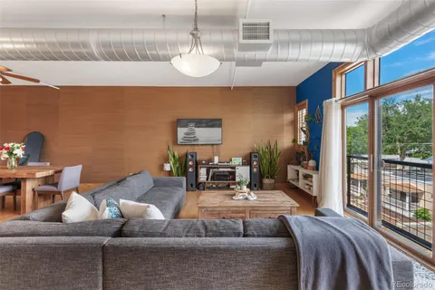 a view of a glass door with a tree