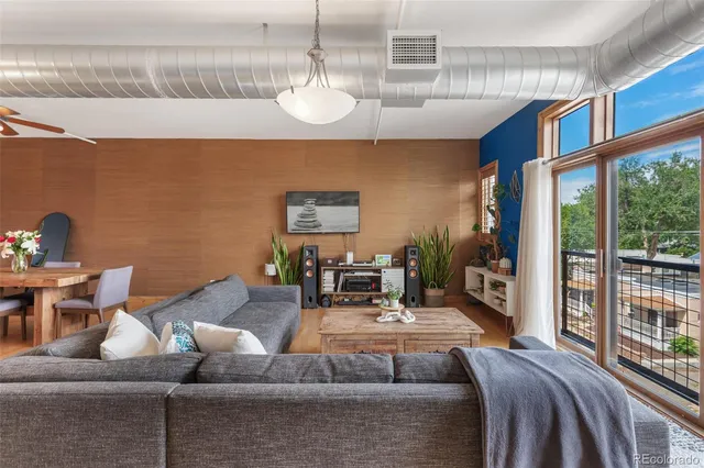 a view of a glass door with a tree
