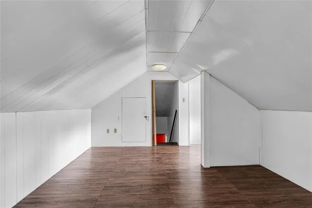 a view of wooden floor and chandelier in a room