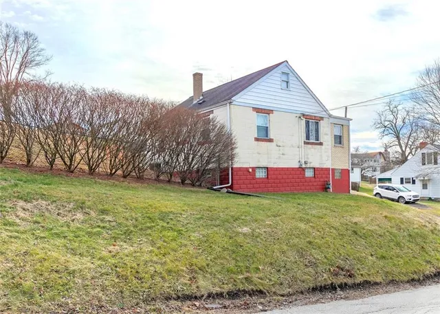 a view of garage and yard