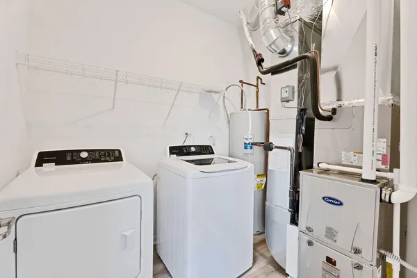 a utility room with dryer and washer