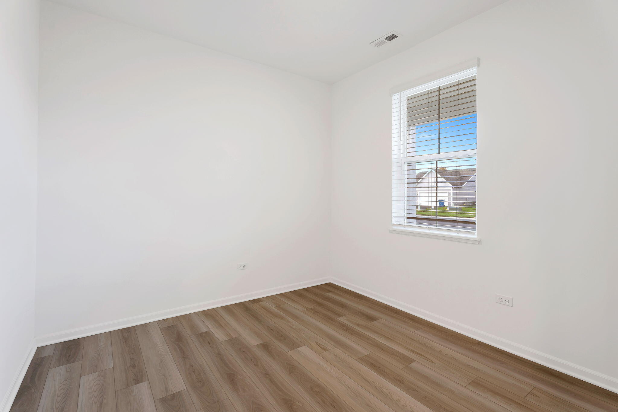 511 East 127th Place Crown Point, IN 46307 - Photo 3 of 22 an empty room with a window