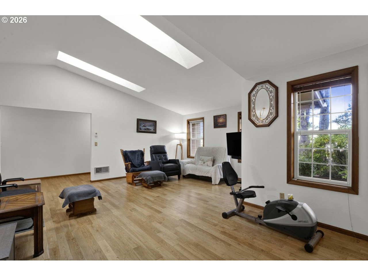 1960 40th Street Florence, OR 97439 - Photo 12 of 48 a living room with furniture a window and a clock