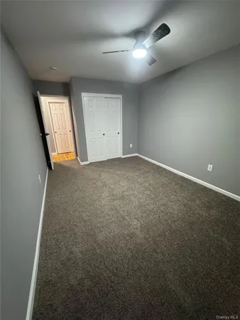 an empty room with a empty space and windows