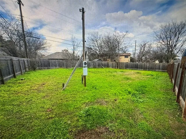 a view of a backyard with a fountain
