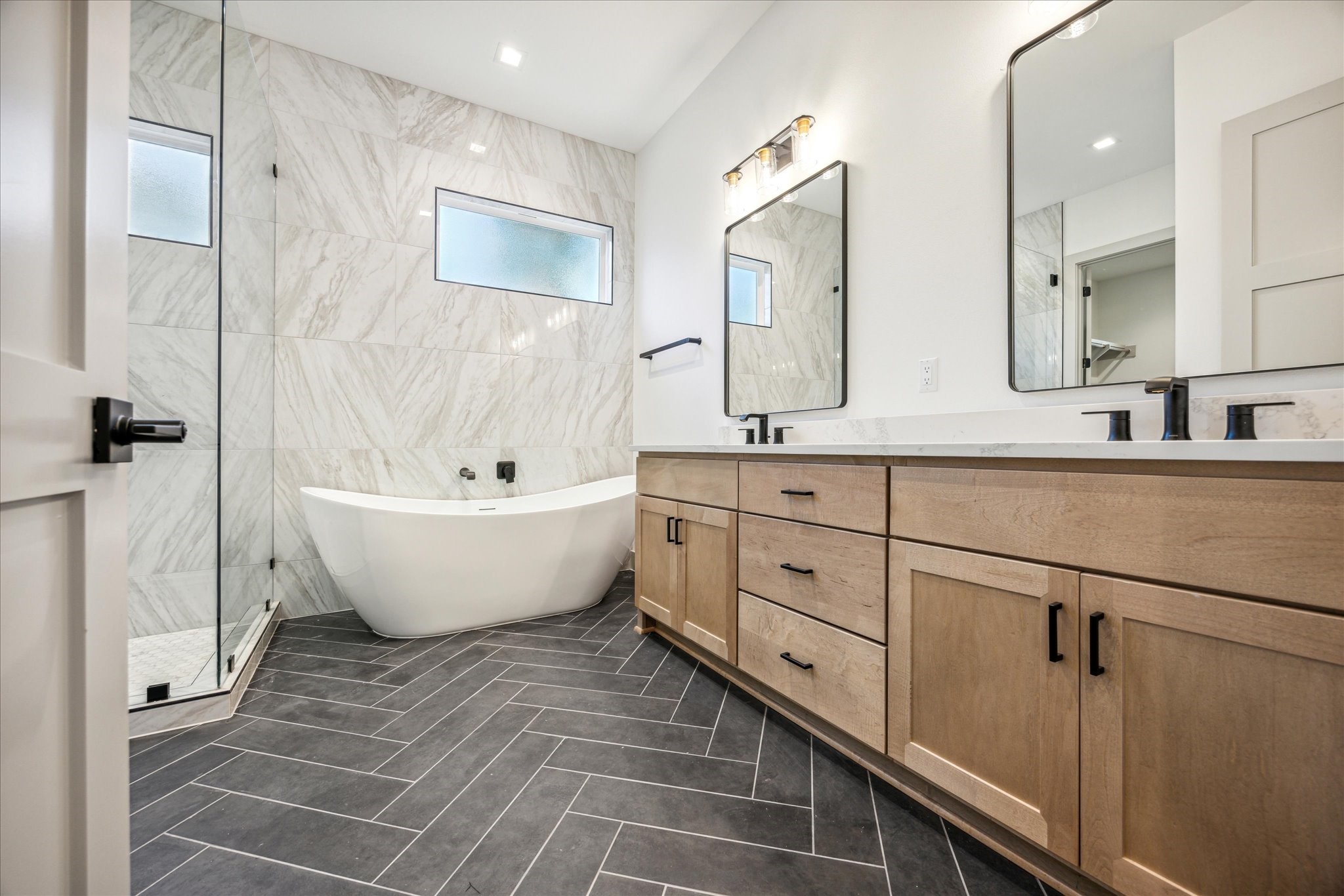 3001 Funston Street Austin, TX 78703 - Photo 10 of 27 a view of a bathroom with bathtub and double vanity