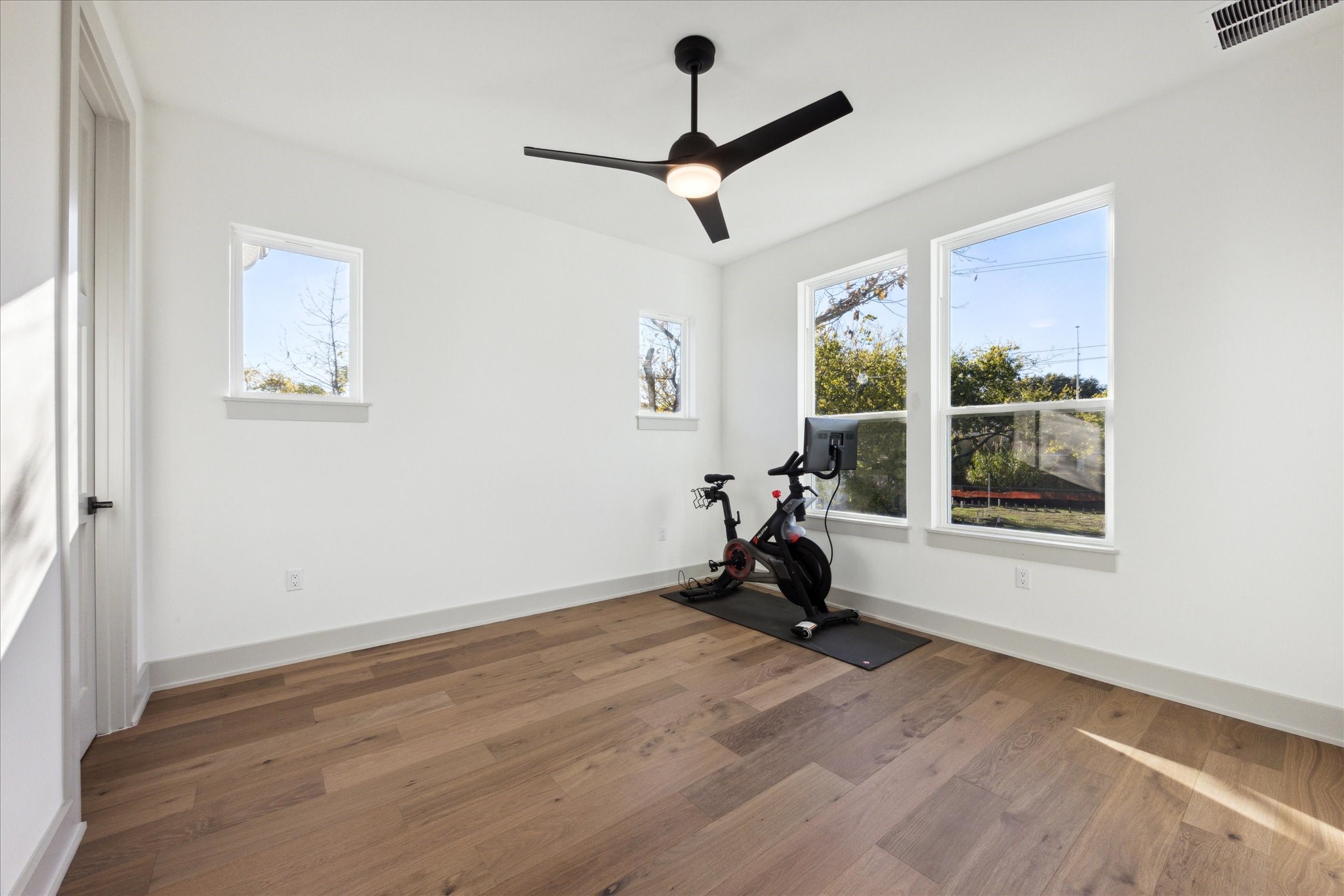 3001 Funston Street Austin, TX 78703 - Photo 17 of 27 a view of a room with gym equipment and a window