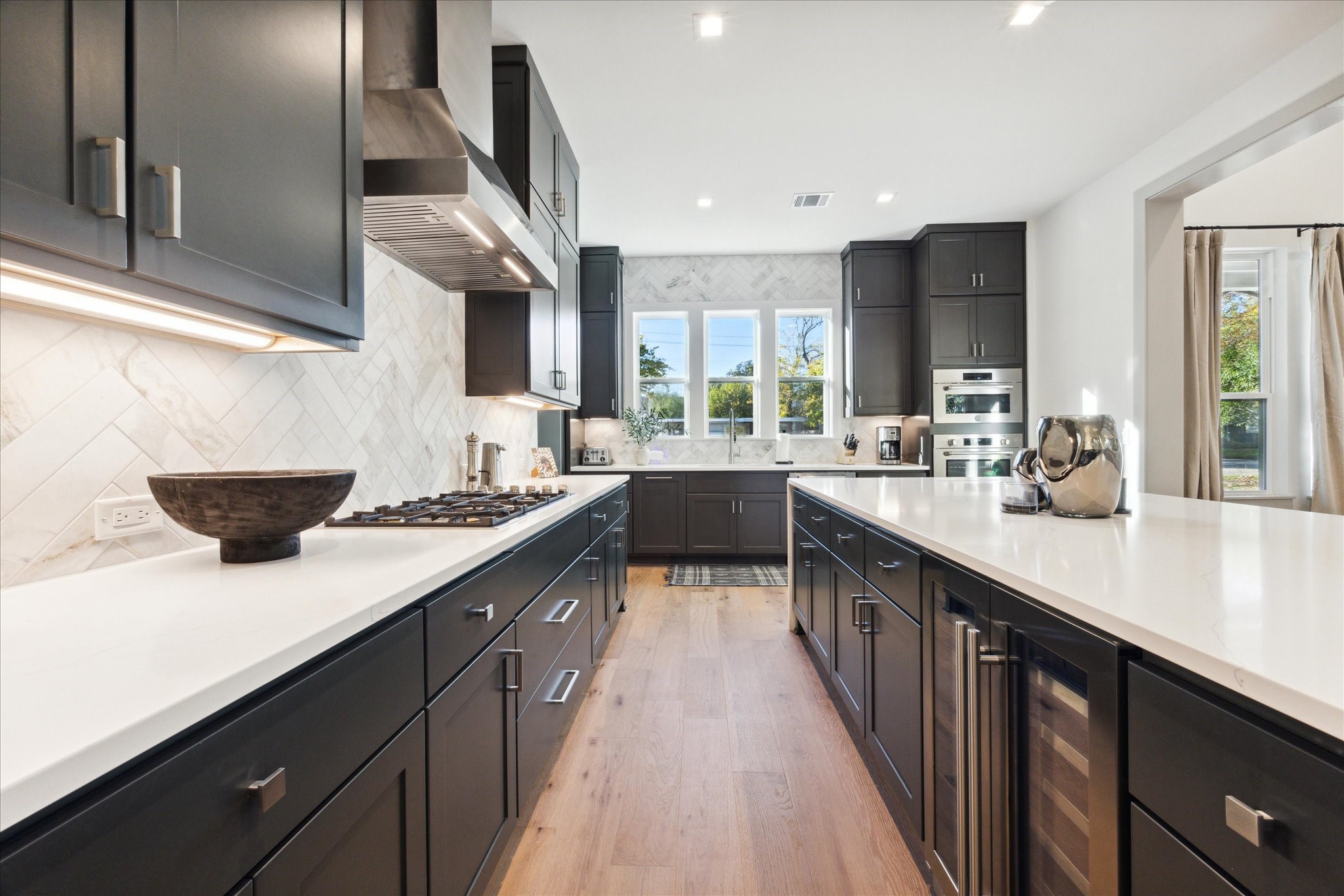 3001 Funston Street Austin, TX 78703 - Photo 2 of 27 a kitchen with stainless steel appliances a sink stove top oven and cabinets