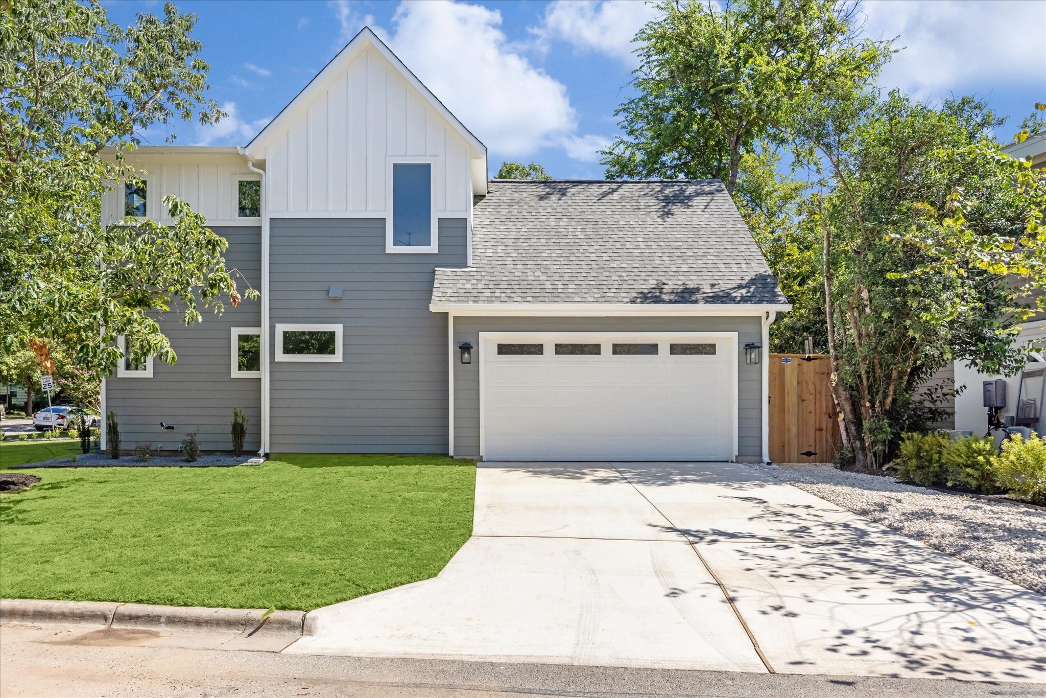 3001 Funston Street Austin, TX 78703 - Photo 24 of 27 a front view of a house with a yard and garage