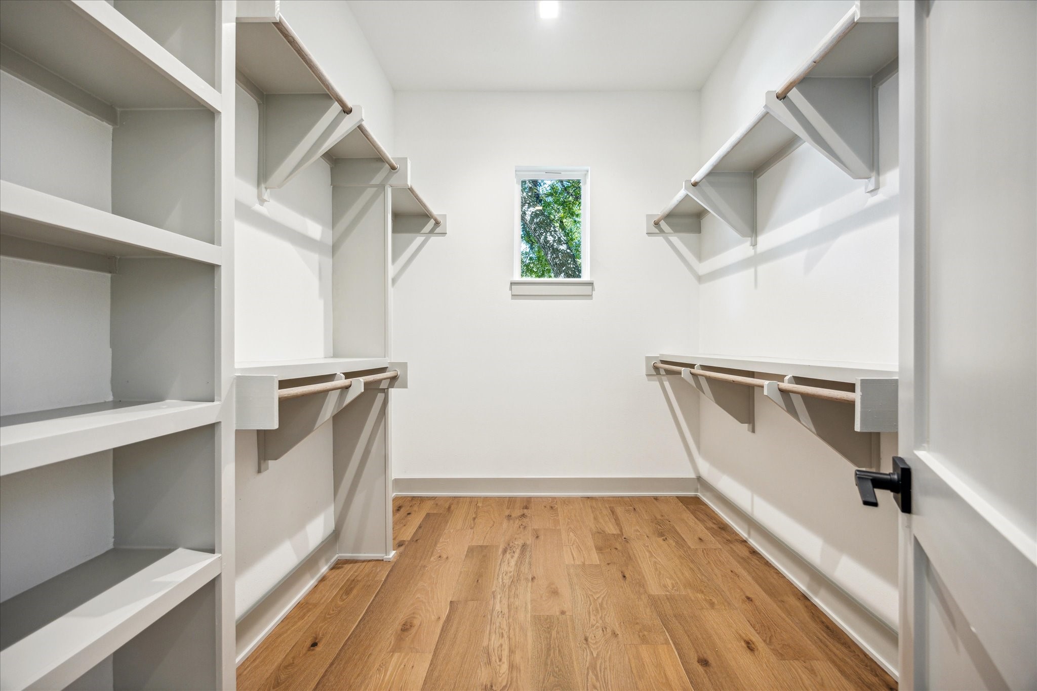 3001 Funston Street Austin, TX 78703 - Photo 5 of 27 a view of a hallway with wooden floor and staircase