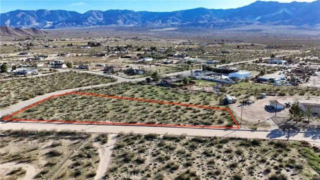 an aerial view of residential house and sandy dunes
