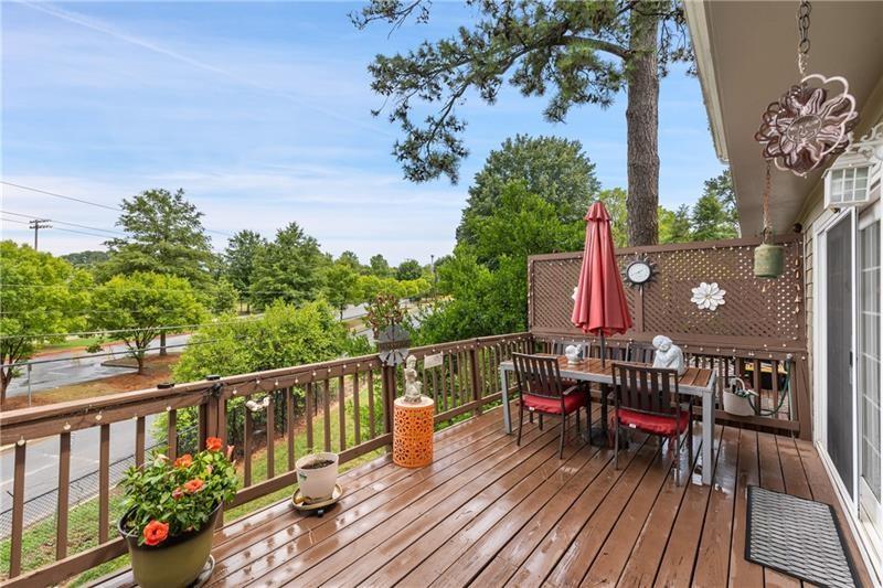 2674 Farmstead Road Smyrna, GA 30080 - Photo 11 of 25 a view of a balcony with wooden floor and outdoor seating