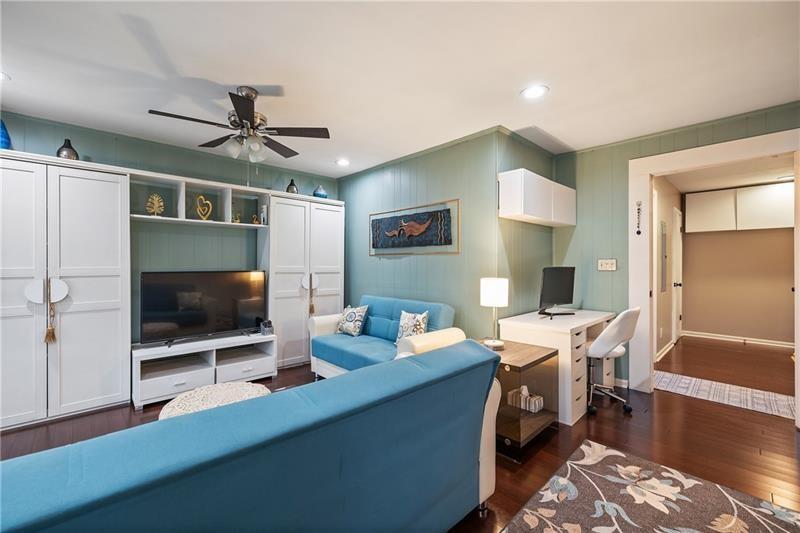 2674 Farmstead Road Smyrna, GA 30080 - Photo 17 of 25 a living room with furniture and a flat screen tv