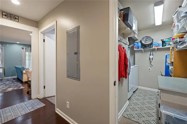 a view of a hallway with workspace and a living room