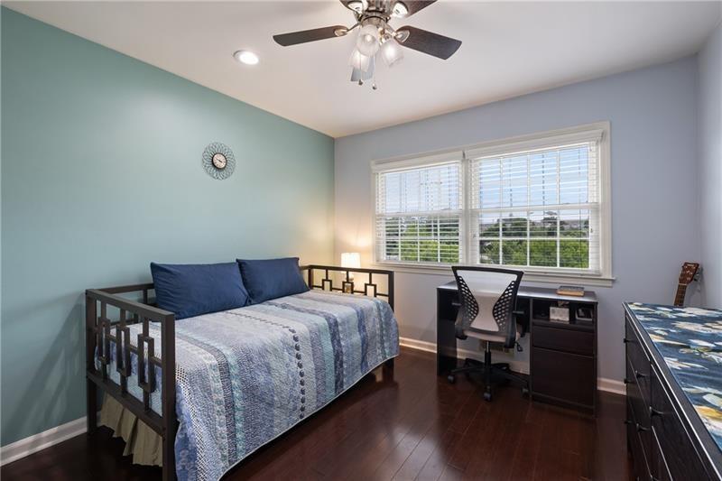 2674 Farmstead Road Smyrna, GA 30080 - Photo 20 of 25 a bedroom with a bed and a table