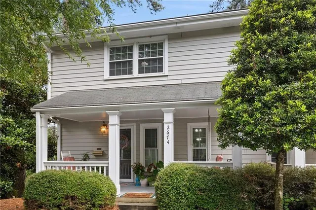 front view of a house with a tree