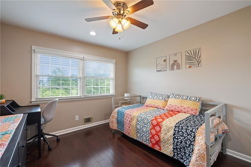 2674 Farmstead Road Smyrna, GA 30080 - Photo 21 of 25 a bedroom with a bed and a window