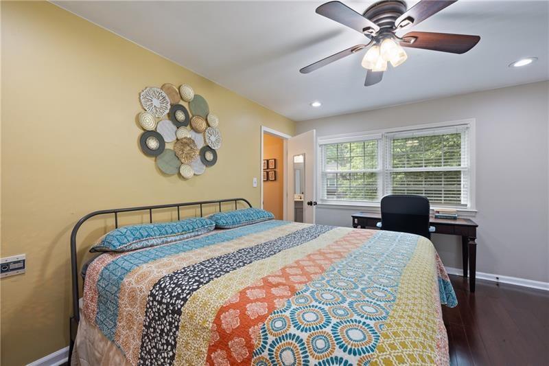 2674 Farmstead Road Smyrna, GA 30080 - Photo 23 of 25 a bedroom with a bed and a table with window