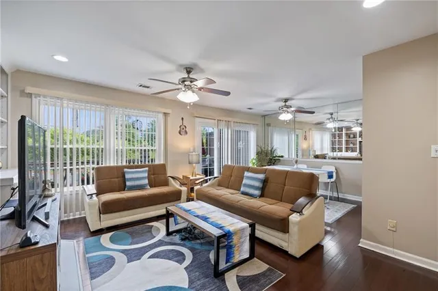 a living room with furniture and a large window