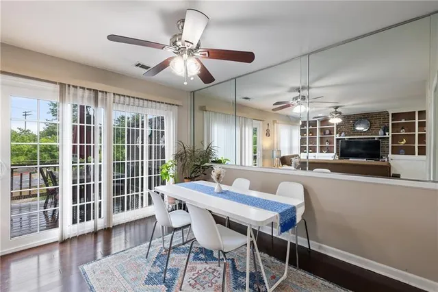 a view of a dining room with furniture window and wooden floor