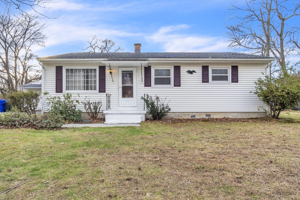 82 Louis Road Springfield, MA 01118 - Photo 1 of 24 a view of a house with backyard and sitting area