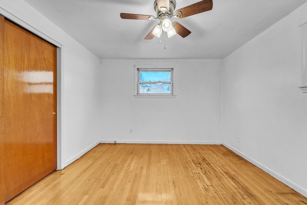 82 Louis Road Springfield, MA 01118 - Photo 12 of 24 a view of empty room with wooden floor