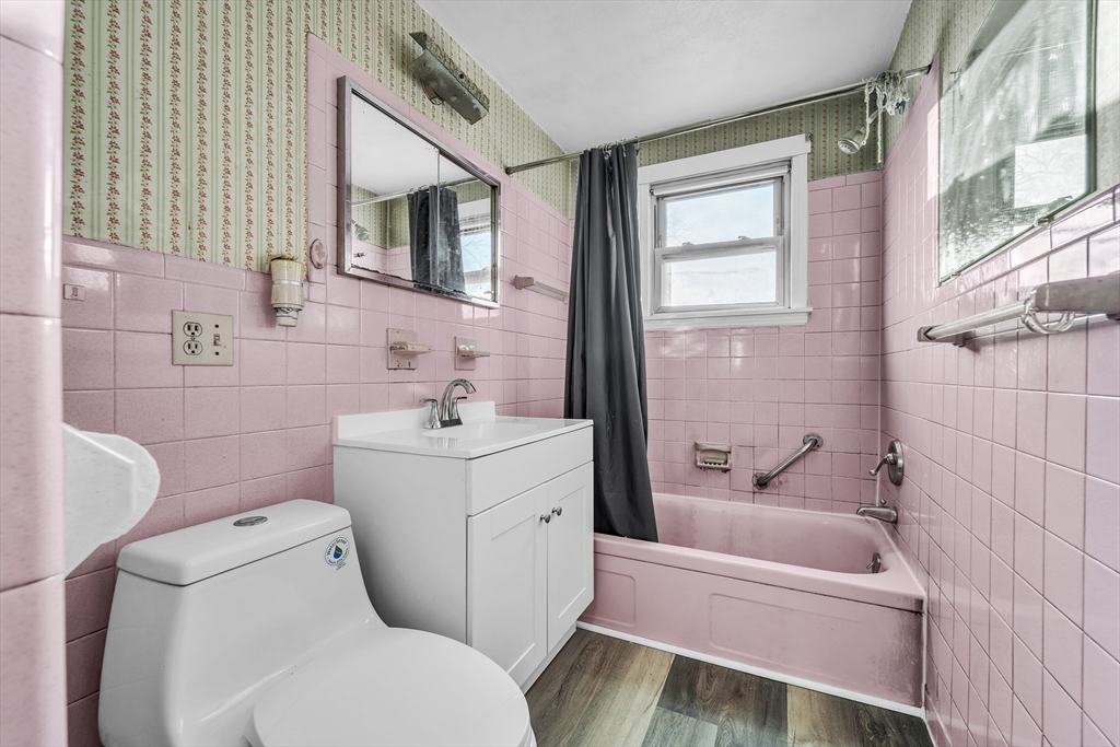 82 Louis Road Springfield, MA 01118 - Photo 14 of 24 a bathroom with a sink toilet and shower