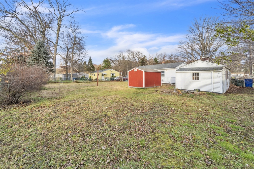 82 Louis Road Springfield, MA 01118 - Photo 18 of 24 a view of a house with a yard