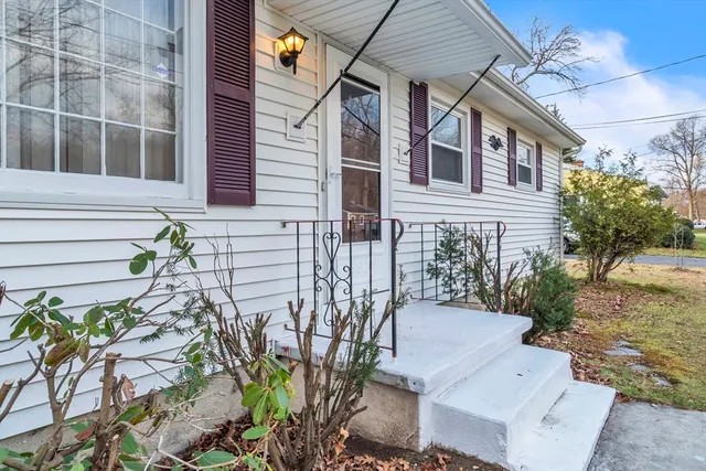 a view of a house with a backyard