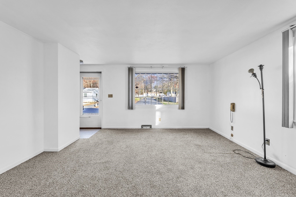 82 Louis Road Springfield, MA 01118 - Photo 4 of 24 an empty room with windows