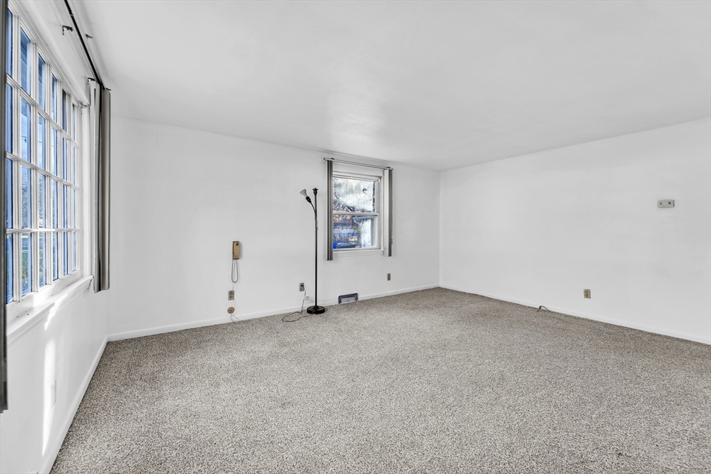 82 Louis Road Springfield, MA 01118 - Photo 5 of 24 an empty room with windows