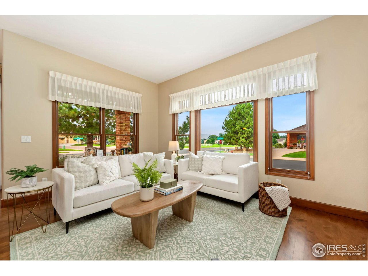 8209 Spinnaker Bay Drive Windsor, CO 80528 - Photo 11 of 26 a living room with furniture and a large window