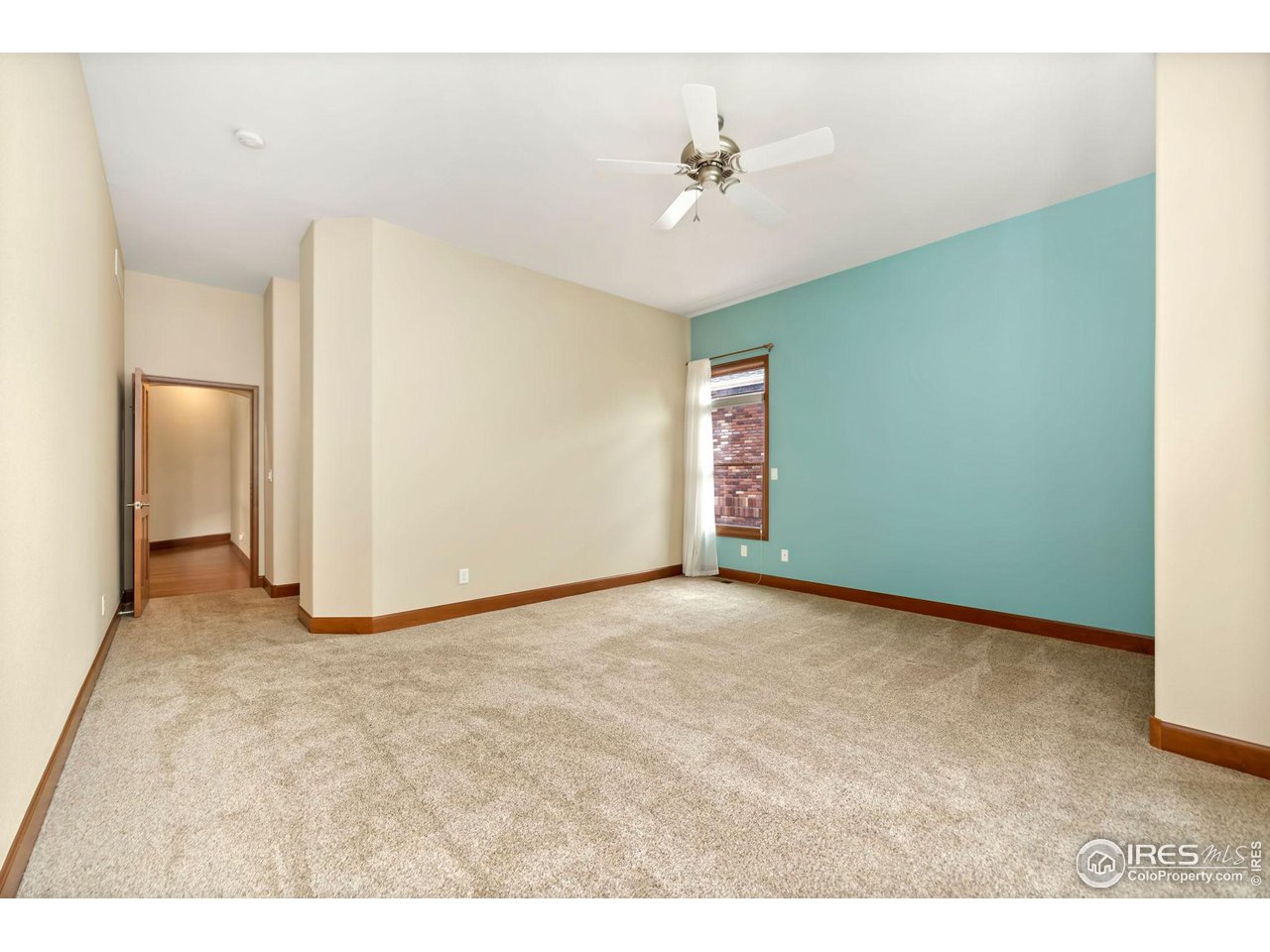 8209 Spinnaker Bay Drive Windsor, CO 80528 - Photo 16 of 26 a view of an empty room with a bathroom