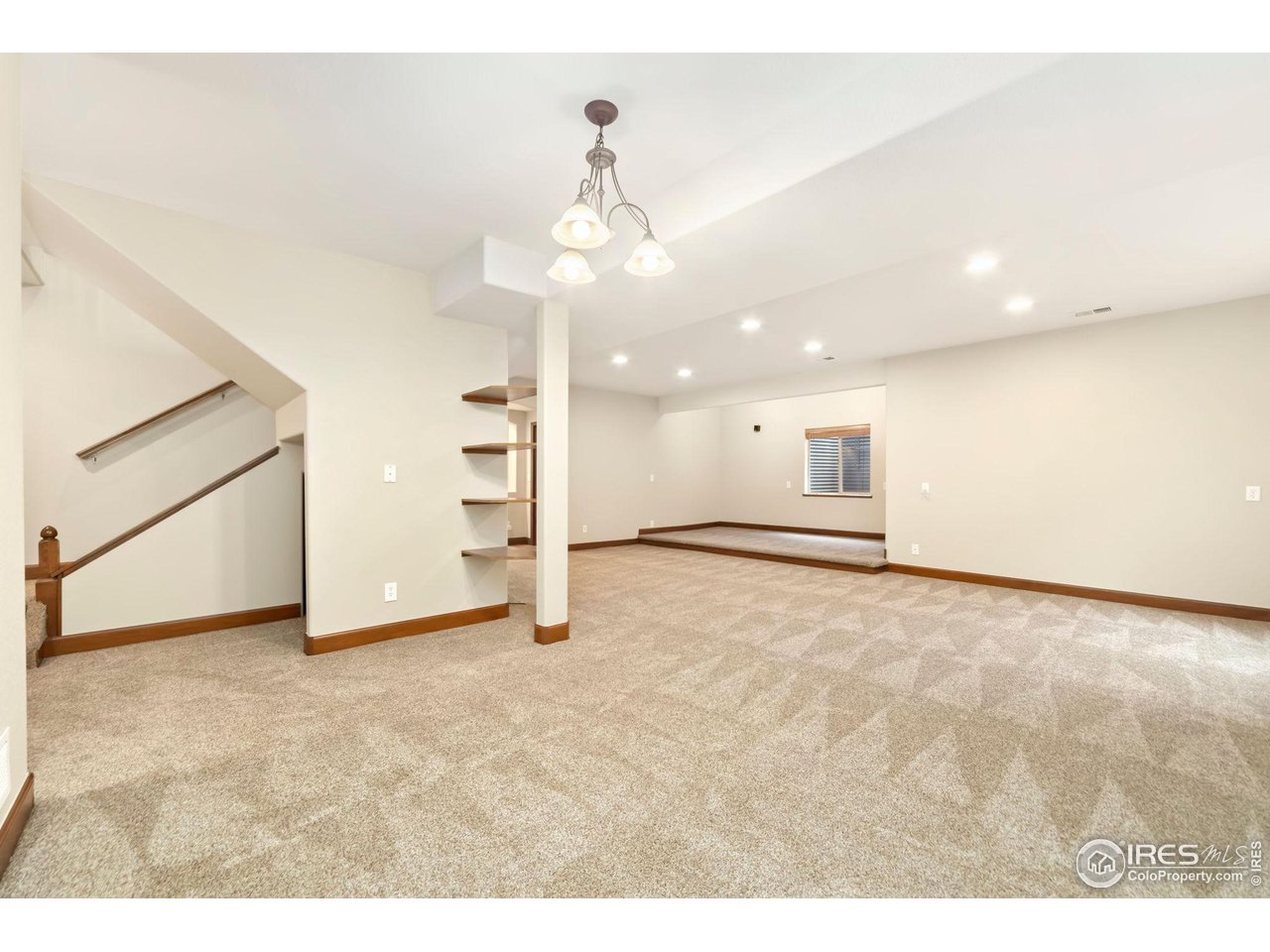 8209 Spinnaker Bay Drive Windsor, CO 80528 - Photo 20 of 26 a view of an empty room with a cabinet