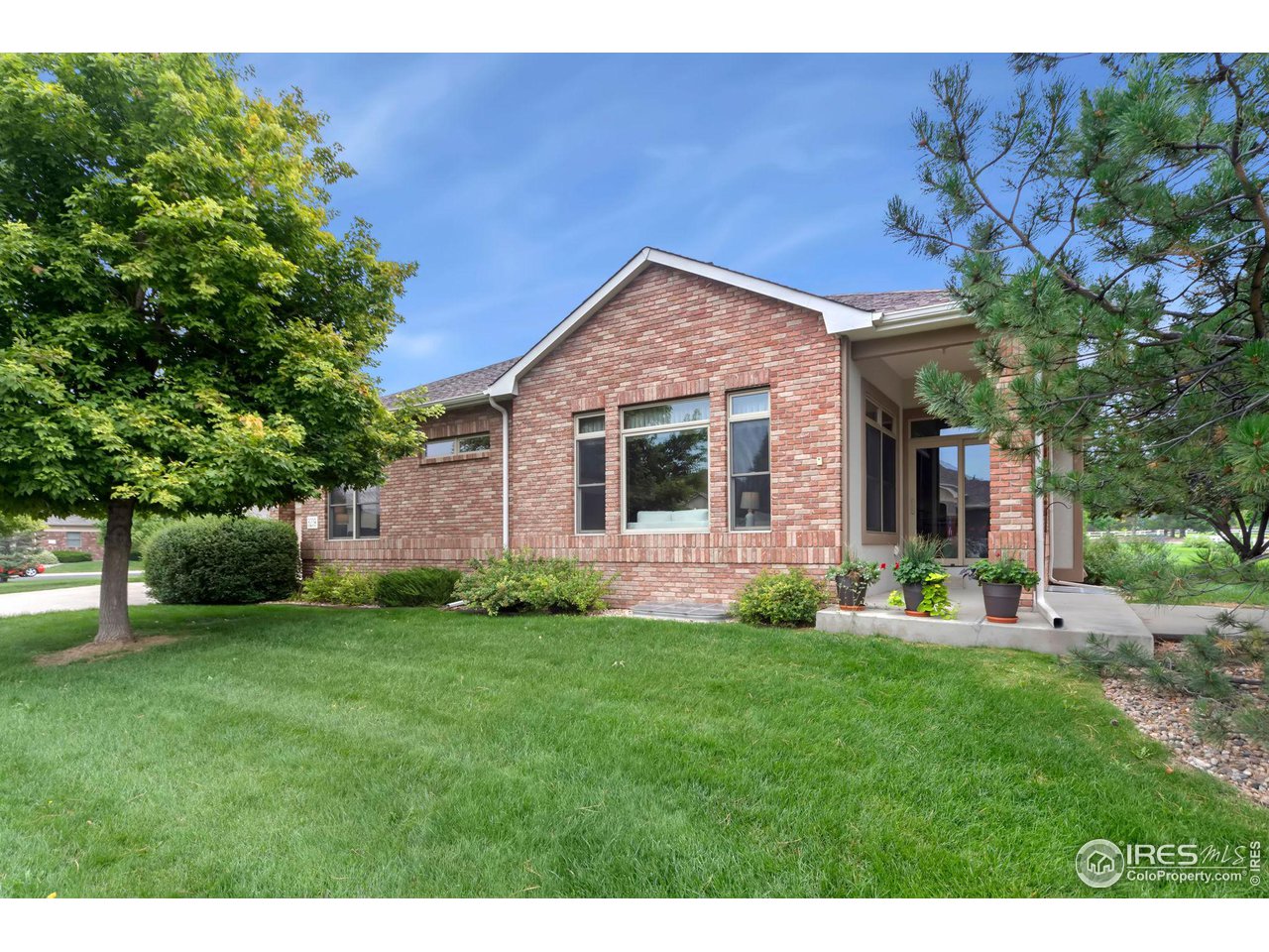 8209 Spinnaker Bay Drive Windsor, CO 80528 - Photo 26 of 26 a view of a house with a yard