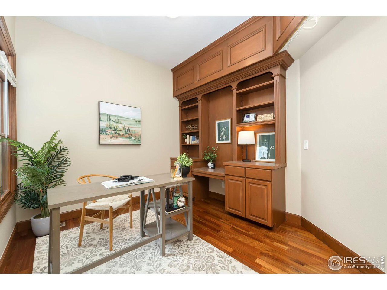 8209 Spinnaker Bay Drive Windsor, CO 80528 - Photo 4 of 26 a dining room with a wooden table and chairs