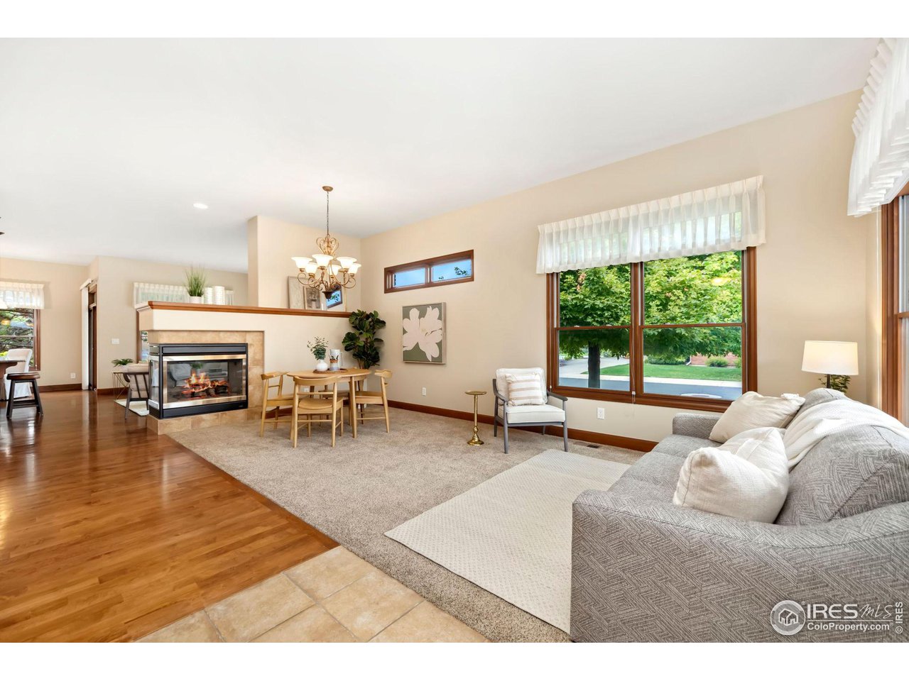8209 Spinnaker Bay Drive Windsor, CO 80528 - Photo 6 of 26 a living room with furniture and a fireplace