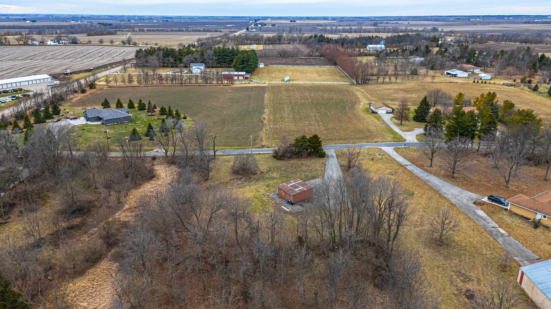 14111 Twin Grove Road Bloomington, IL 61705 - Photo 3 of 6 an aerial view of residential houses with outdoor space