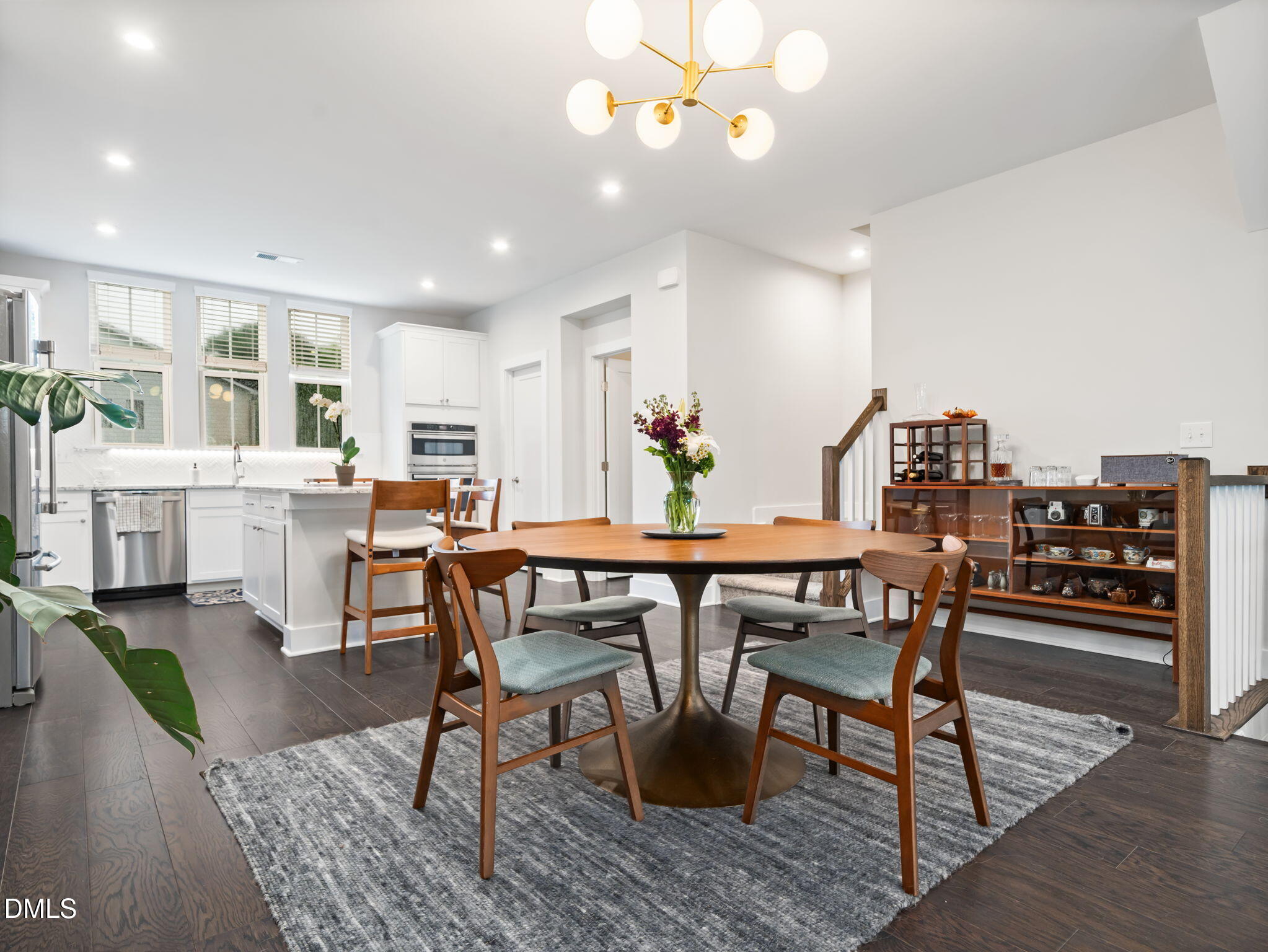 916 Waterside View Drive Raleigh, NC 27606 - Photo 7 of 22 a view of a dining room with furniture and wooden floor