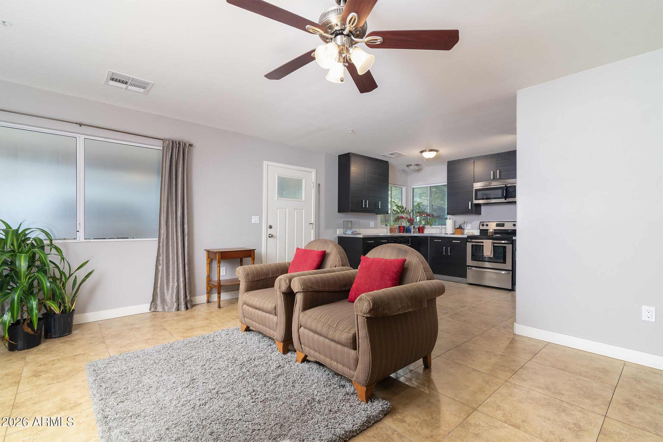 822 East Montecito Avenue Phoenix, AZ 85014 - Photo 12 of 48 a living room with furniture and a flat screen tv
