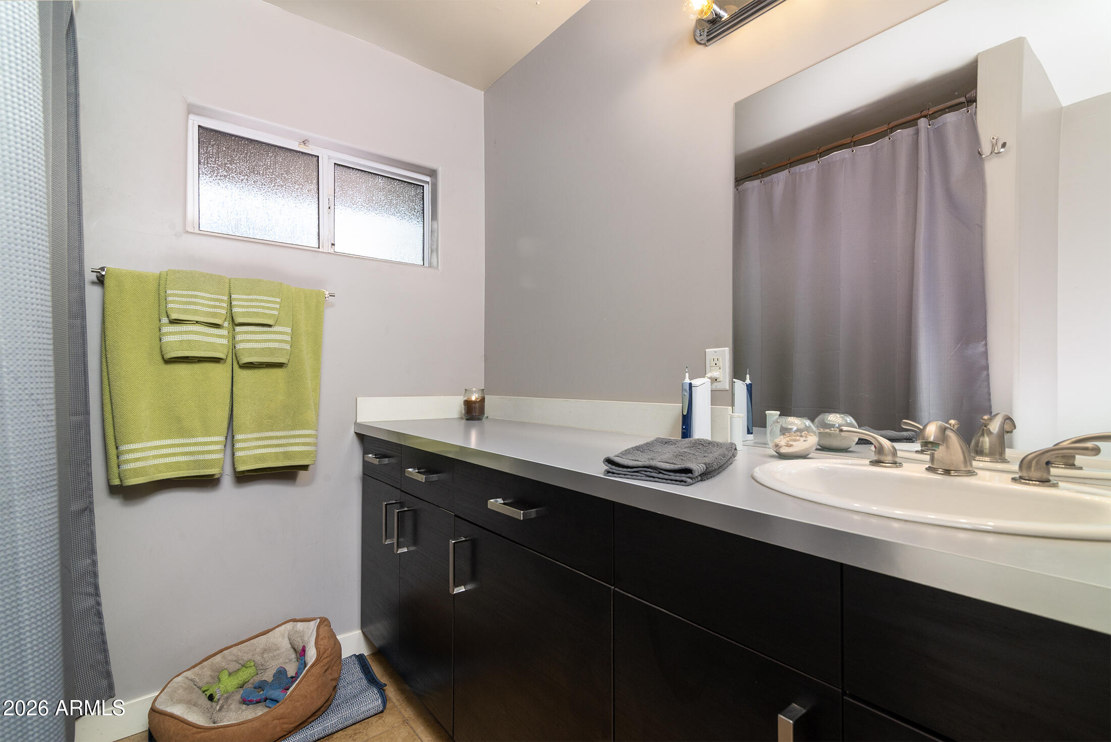 822 East Montecito Avenue Phoenix, AZ 85014 - Photo 14 of 48 a bathroom with a sink and a mirror