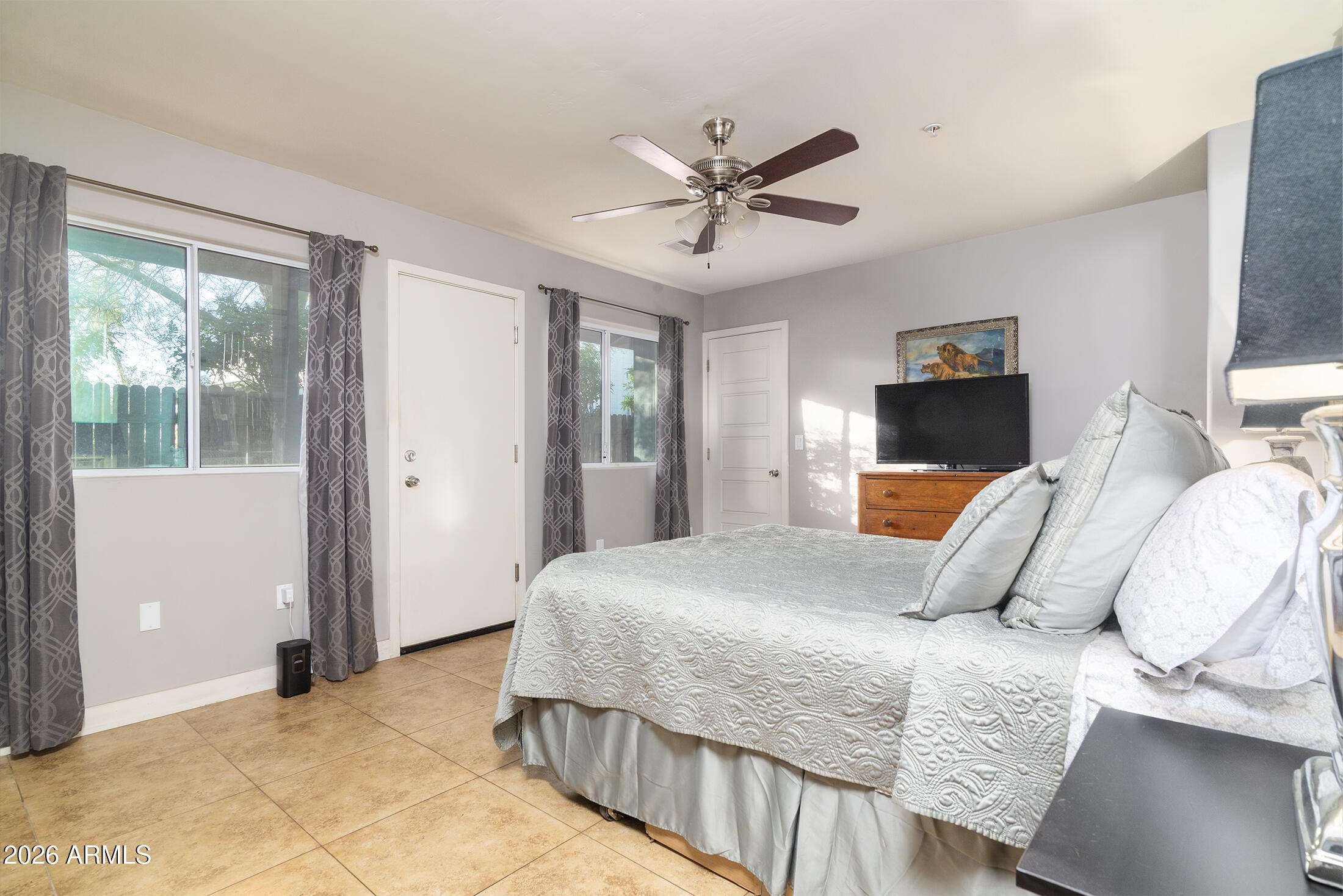 822 East Montecito Avenue Phoenix, AZ 85014 - Photo 15 of 48 a bedroom with a bed and wooden floor