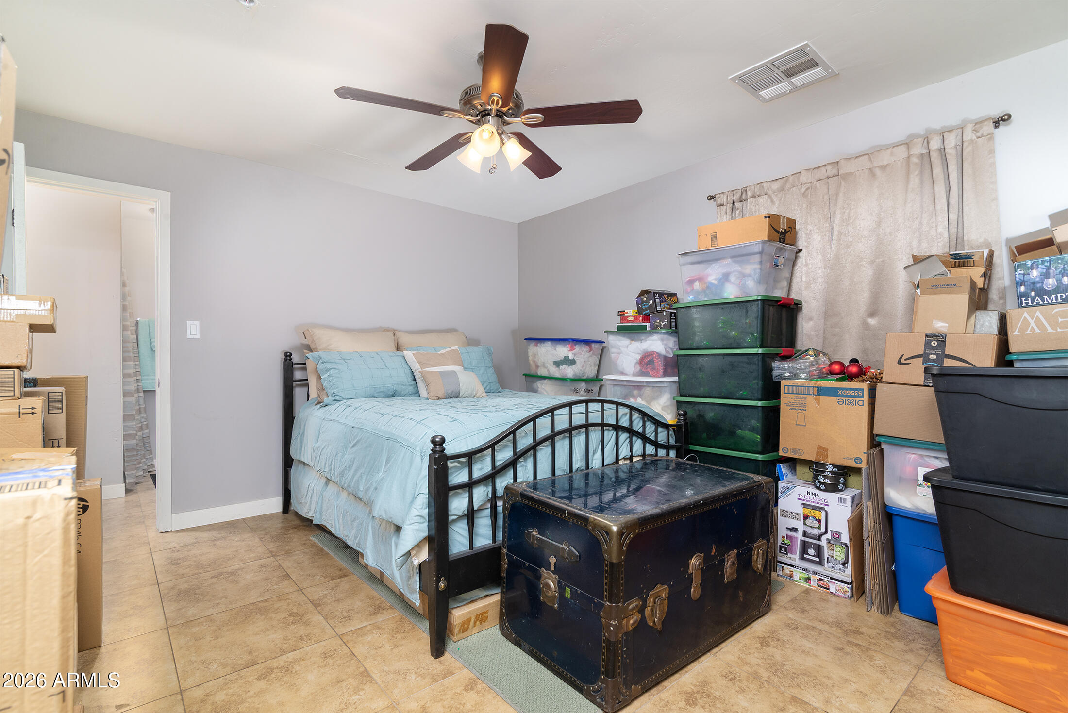 822 East Montecito Avenue Phoenix, AZ 85014 - Photo 17 of 48 a bed room with a bed and a chandelier